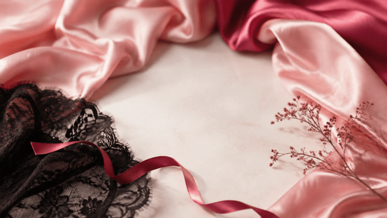Blush satin, black lace and raspberry ribbon arranged for The Blush Journal